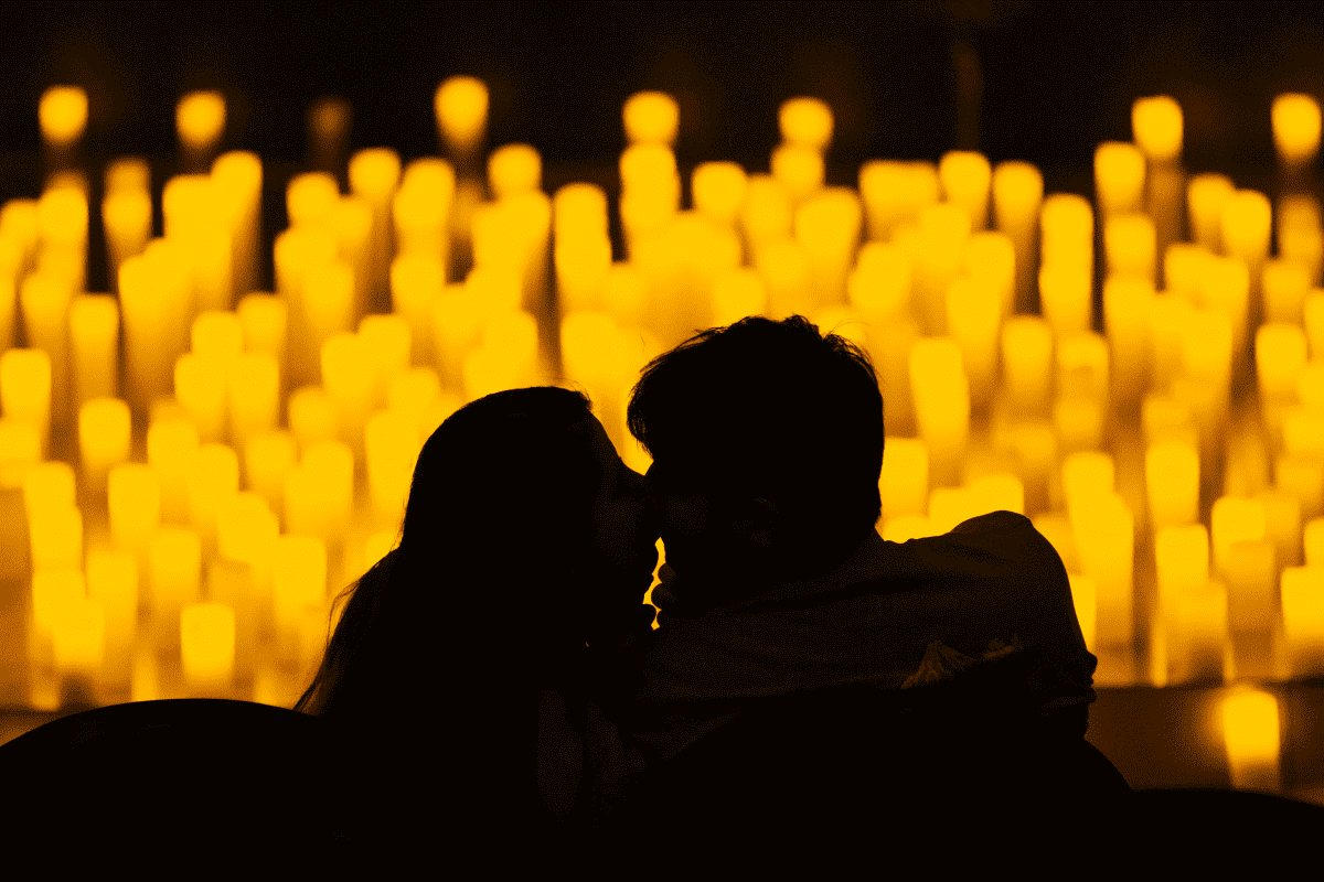 Couple kissing by candlelight 