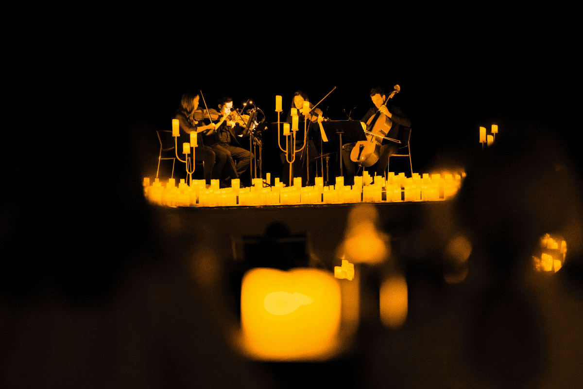 String quartet illuminated by candles