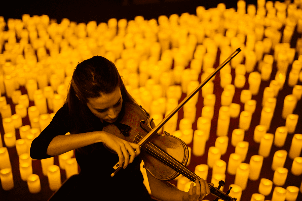 Musician playing by candlelight
