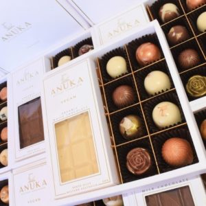 Open boxes of artisan chocolate truffles