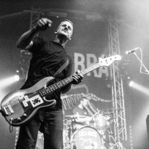Luca Brasi guitarist singing on stage, black and white image