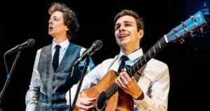 Oliver Cave as Art Garfunkel (left) and William Sharp as Paul Simon (right)