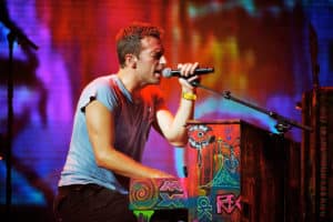 Close up of Coldplay singing/playing piano on stage