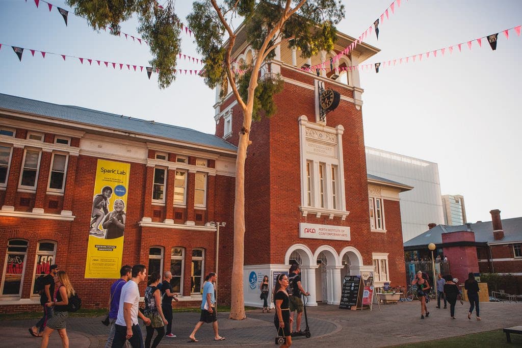 Crowds walking past historic gallery in Perth