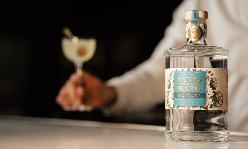 bottle of Banks & Bloom's award-winning vodka with blurred martini in background