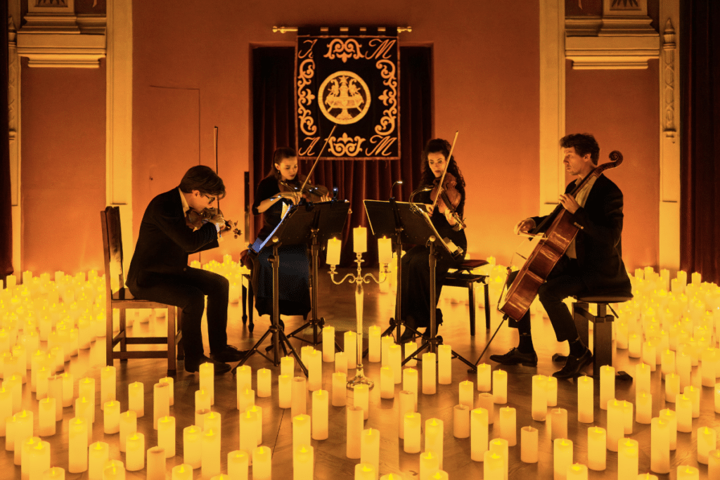 String quartet performing on stage at a Candlelight concert